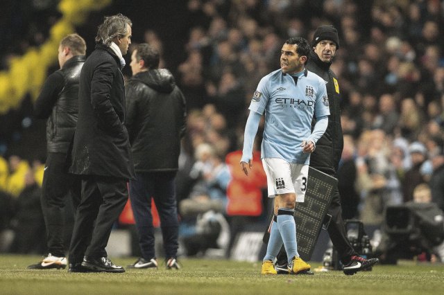 Schwierige Beziehung in Manchester: Stürmer Carlos Tevez (r.) und Trainer Roberto Mancini