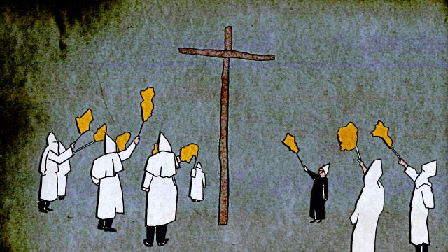 Mitglieder des US-Geheimbundes Ku-Klux-Klan bei einer Zeremonie mit Kreuzverbrennung.